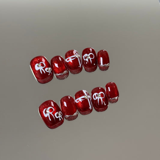 Ultra-Short Round Red Cat Eye &  Hand-Painted White Bow Handmade Press-On Nails | Removable & Reusable with Free Tool Kit